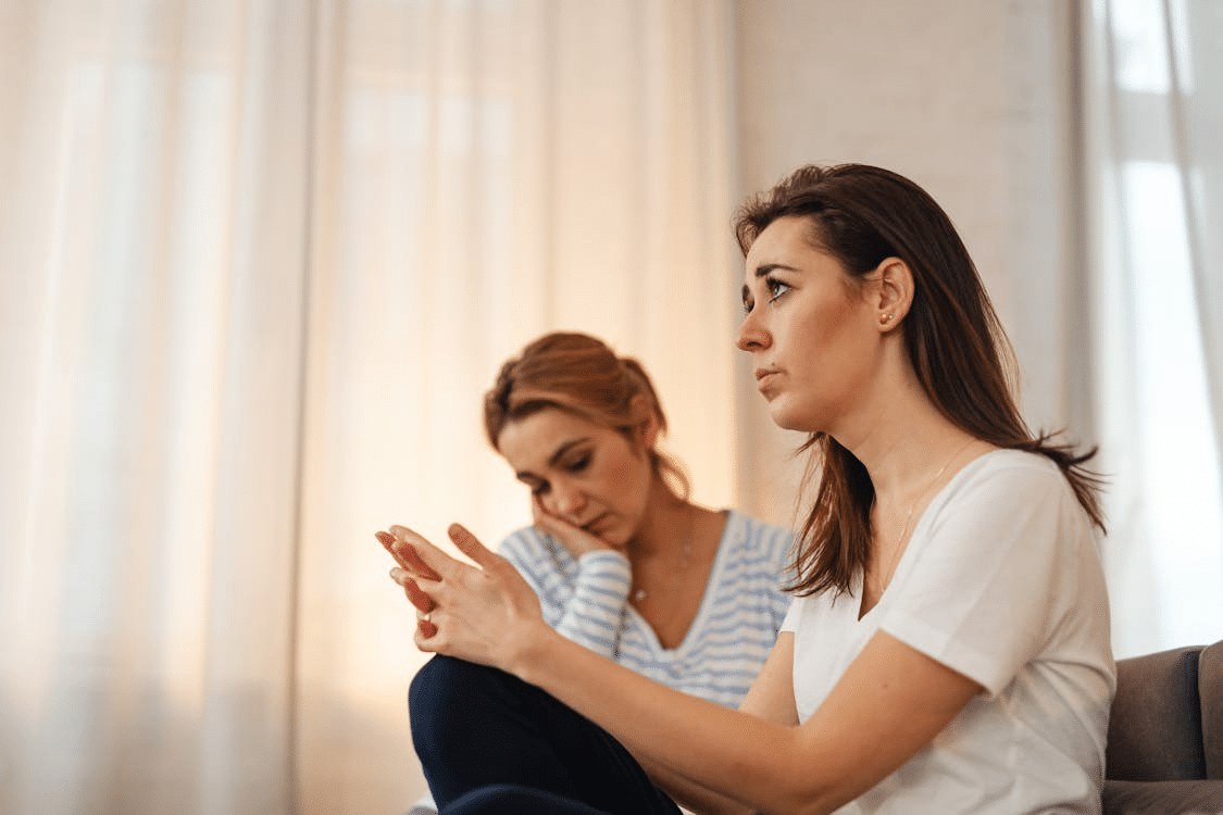 Two Women Sitting in a Room