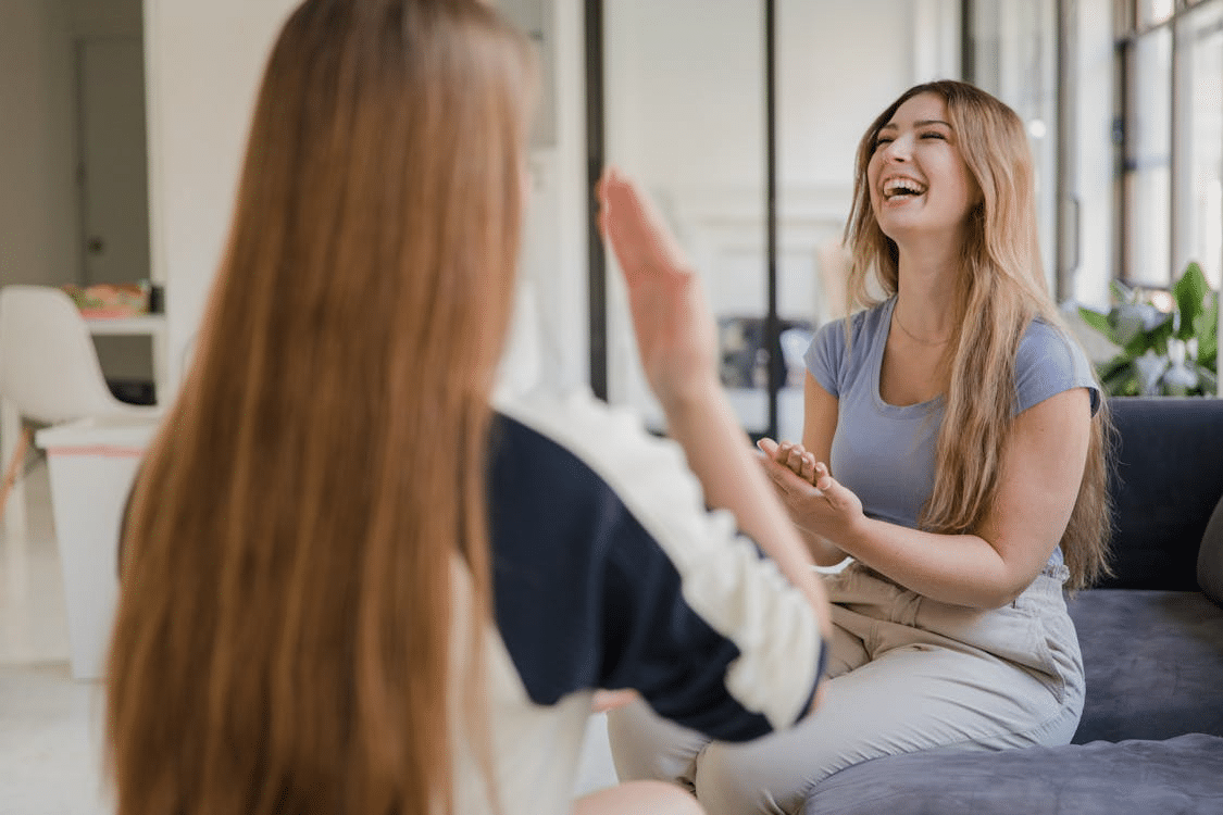 Young Women Making Conversation