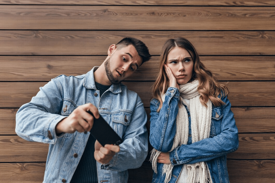 Woman ignoring man on phone