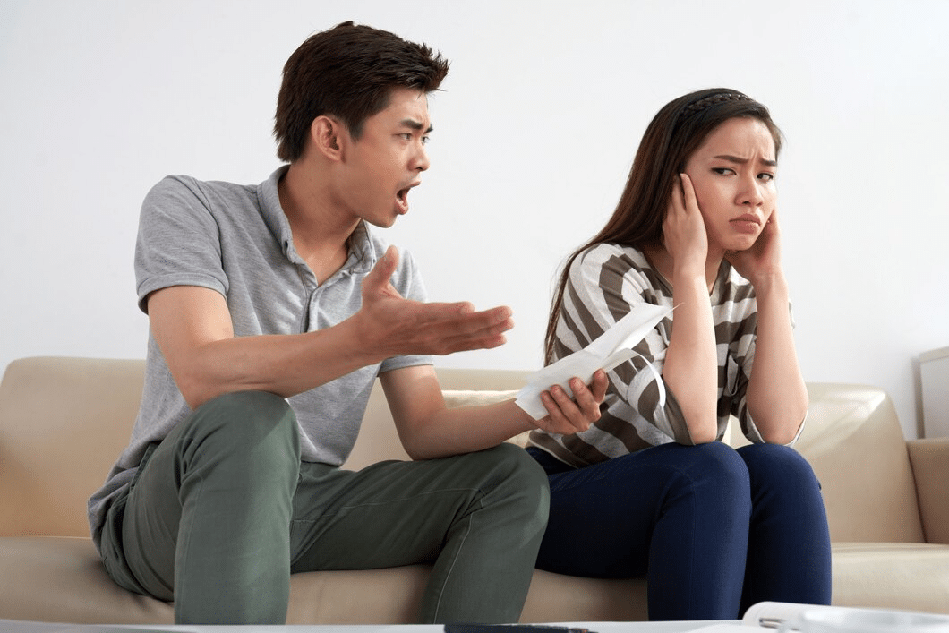 Asian man shouting at his wife