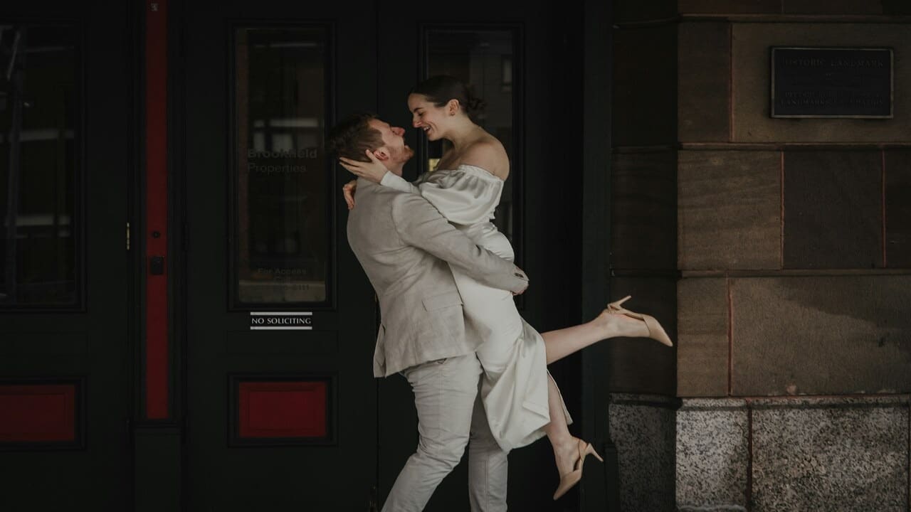 A couple hugging by the door