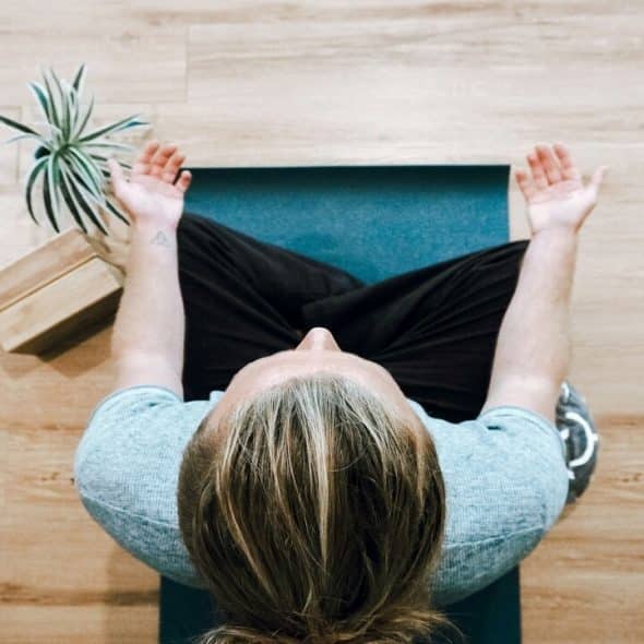 A woman doing breathing exercises