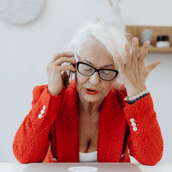An angry old woman talking to someone on the phone