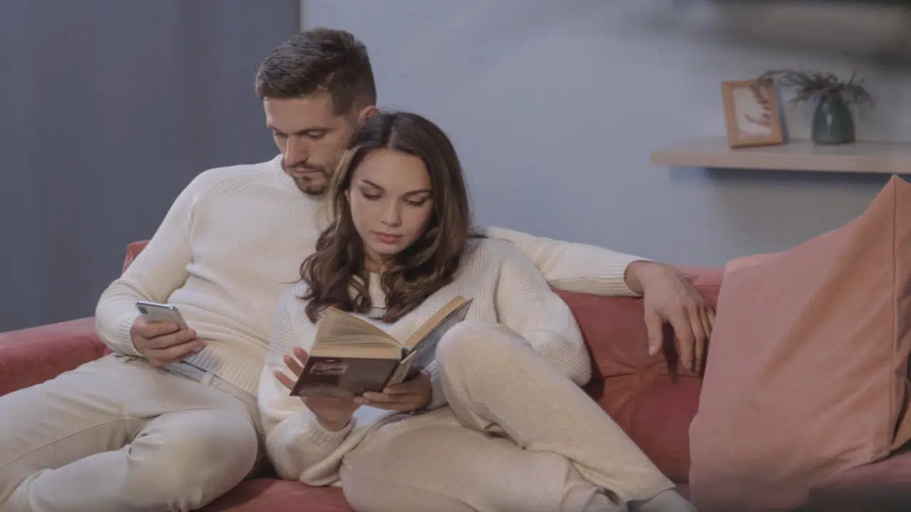 A couple ignoring each other at home