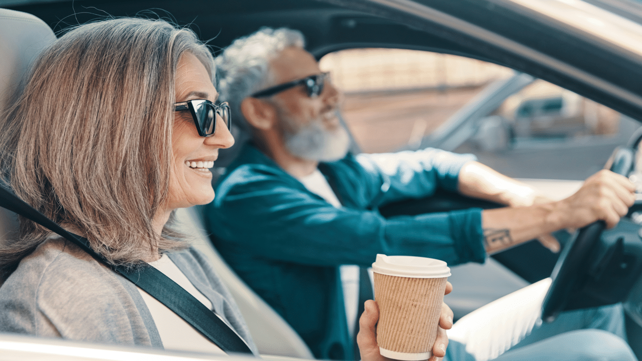 A couple driving to work together