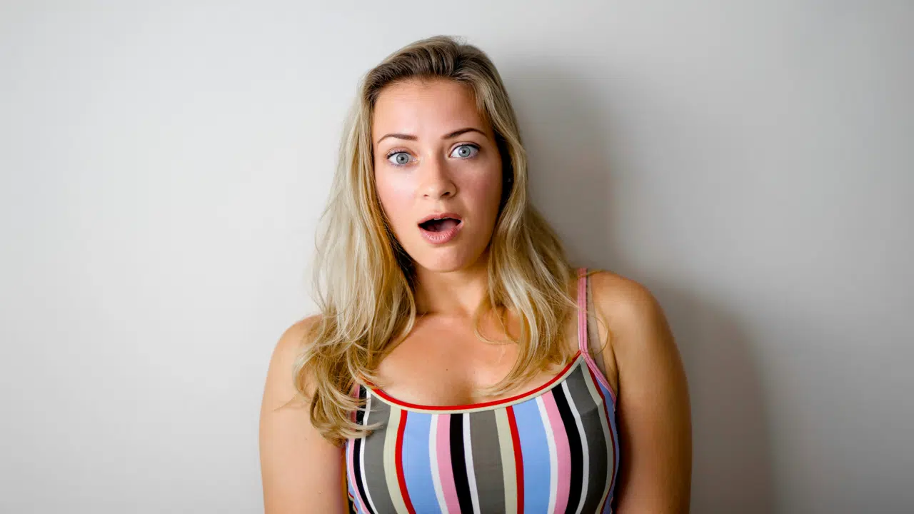A woman making a mocking face
