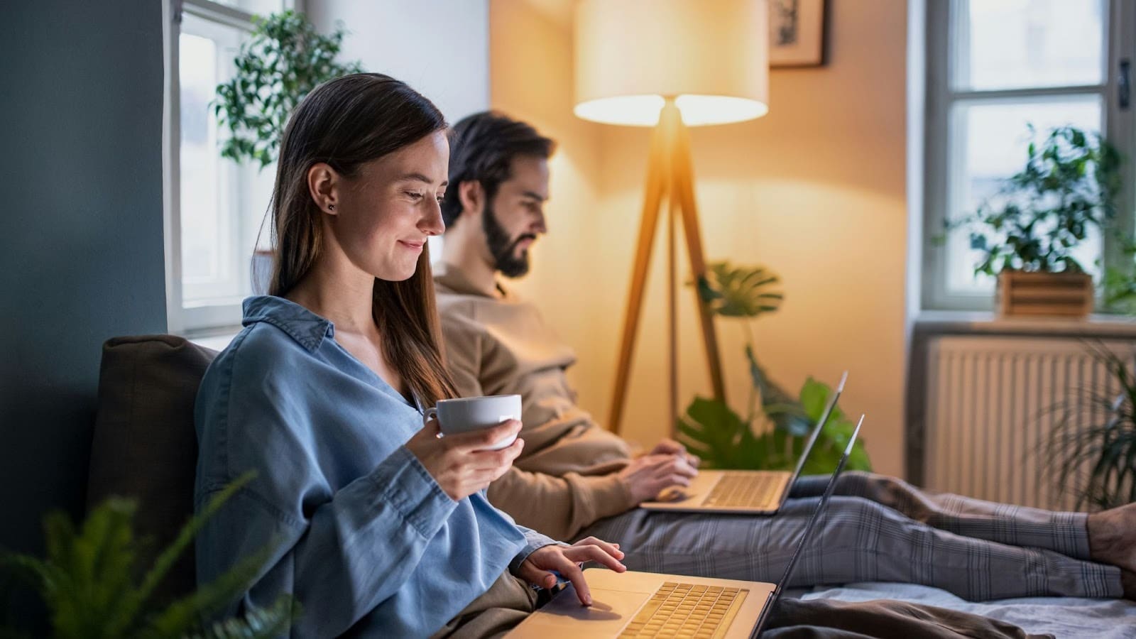 A man and woman busy with their work