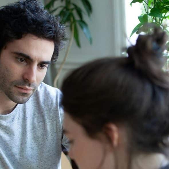 A man looking at the woman