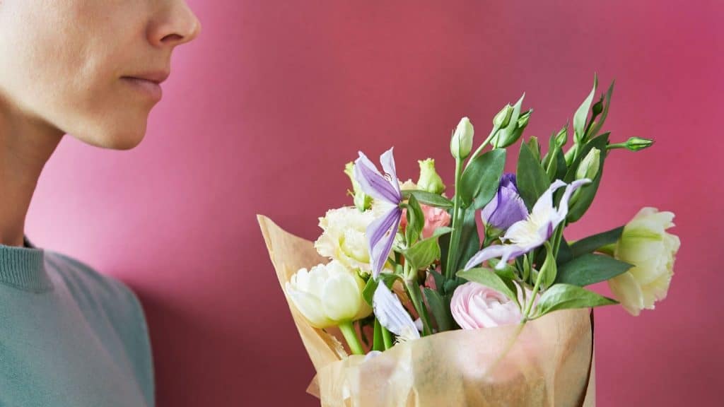 Woman holding a flower 