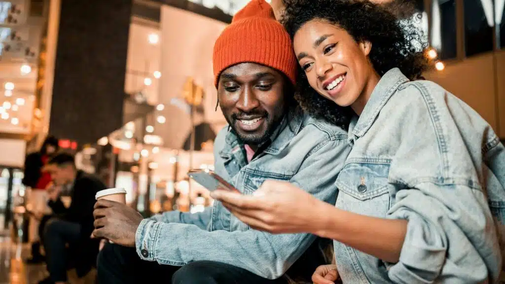 Woman showing something to a man