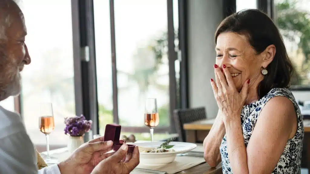 A man giving a jewelry to woman