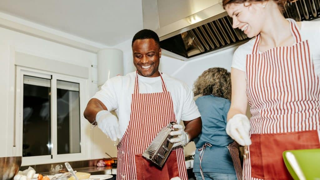 A man and woman at the cooking class