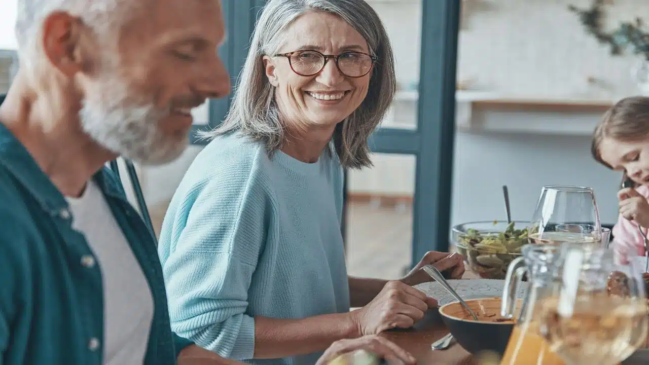 A mature couple talking during dinner