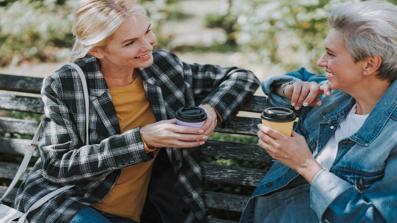 Two mature ladies having coffee