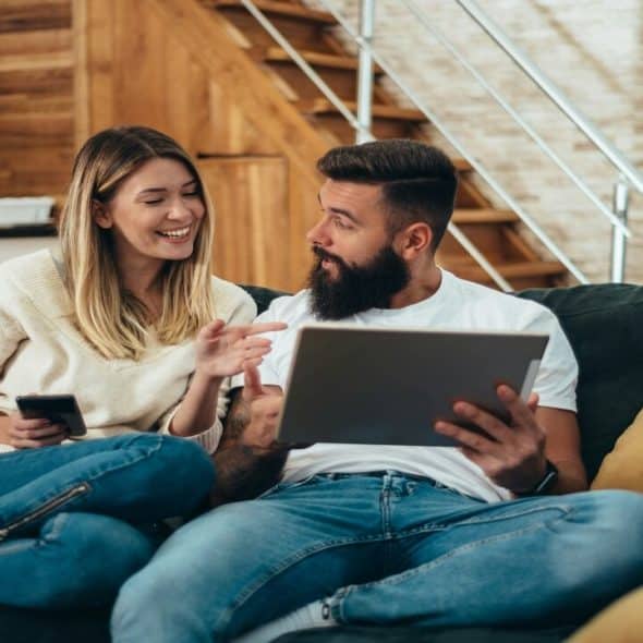 A couple talking in the living room