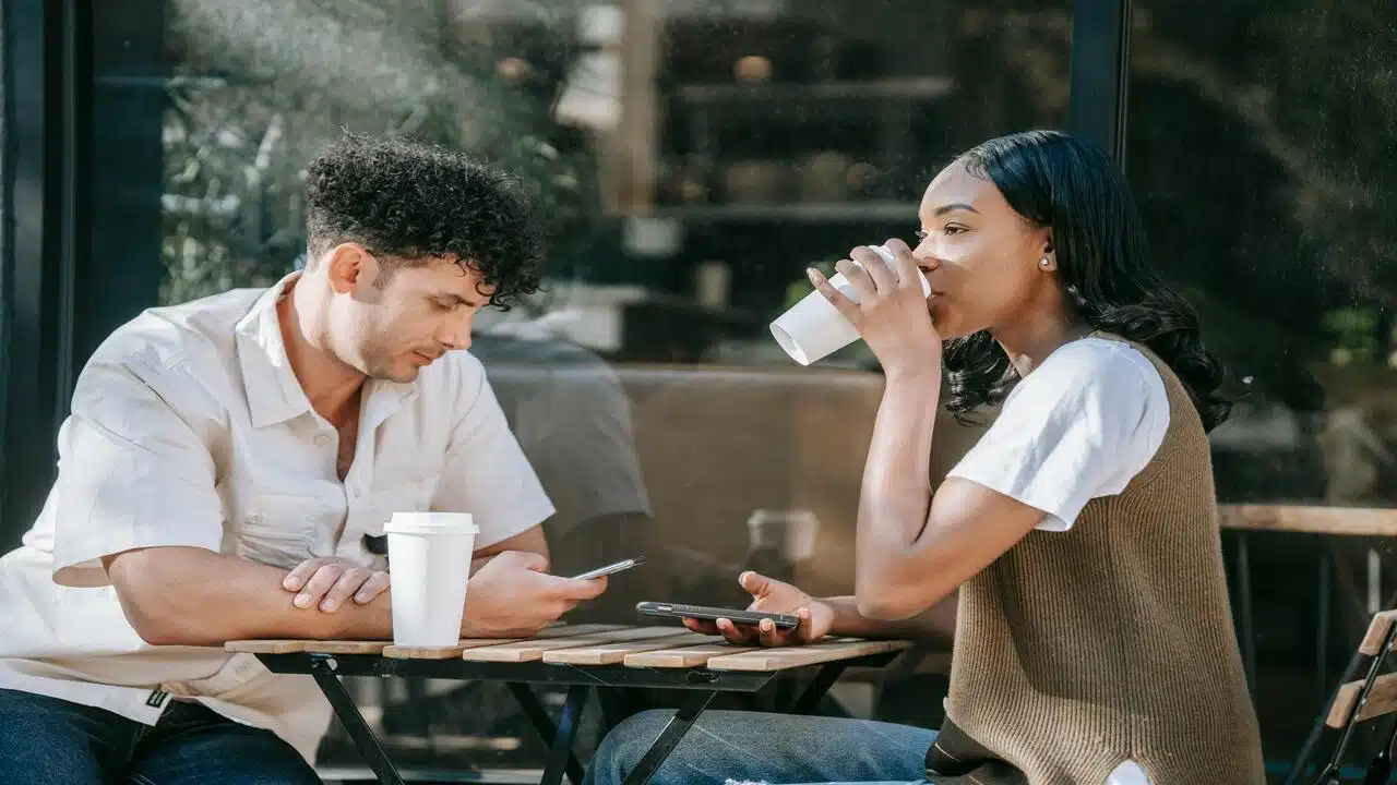 A couple looking serious during a coffee date