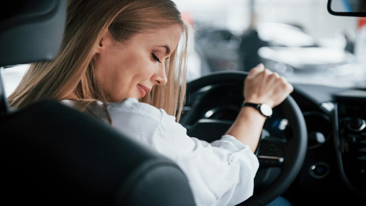 A woman driving by herself