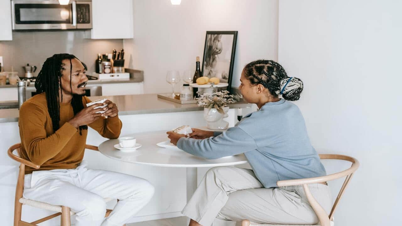A couple having a serious talk at home