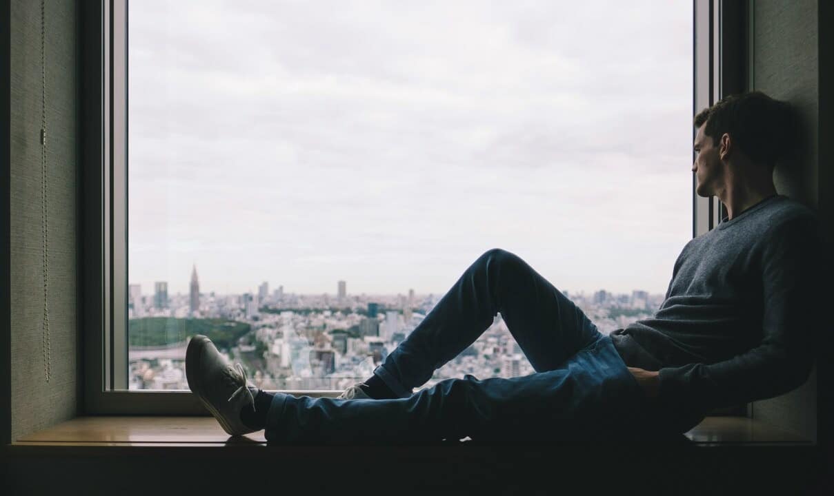 A man looking out the window