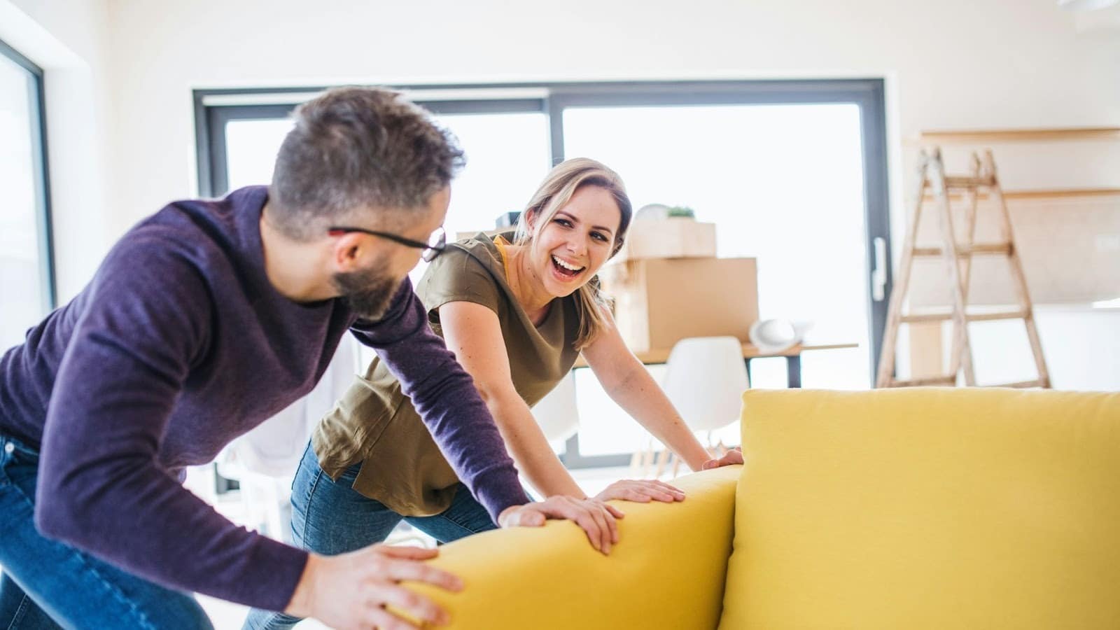 A man and woman helping each other