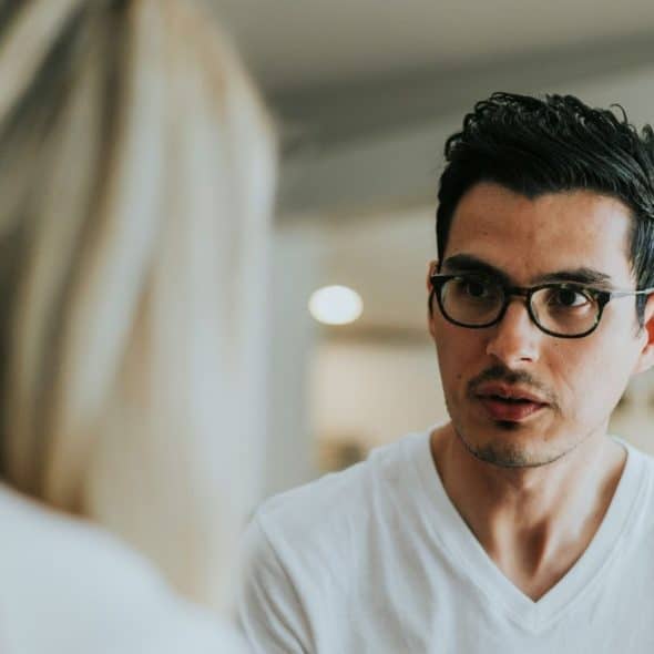A man explaining something to woman