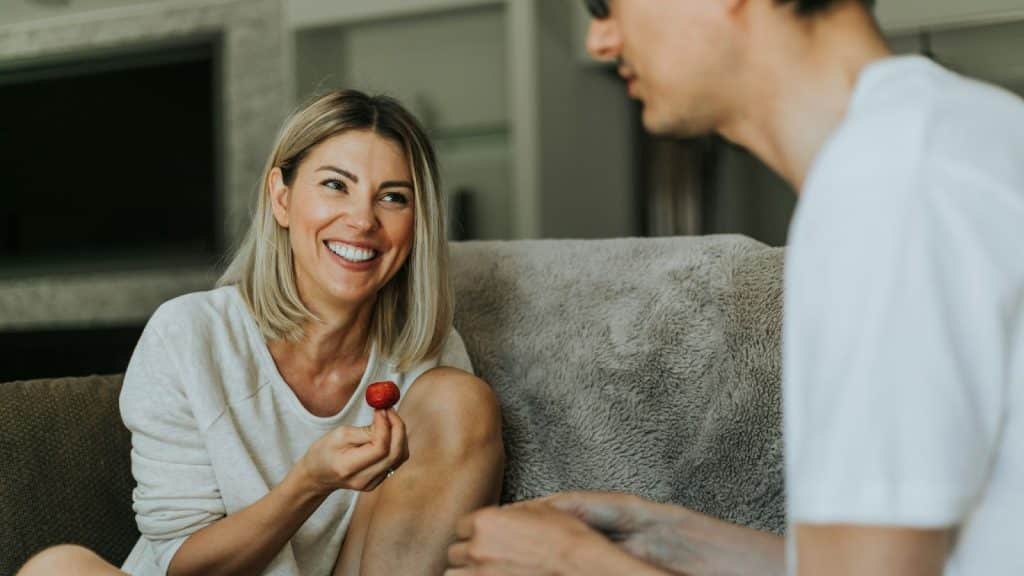 Woman smiling to a man