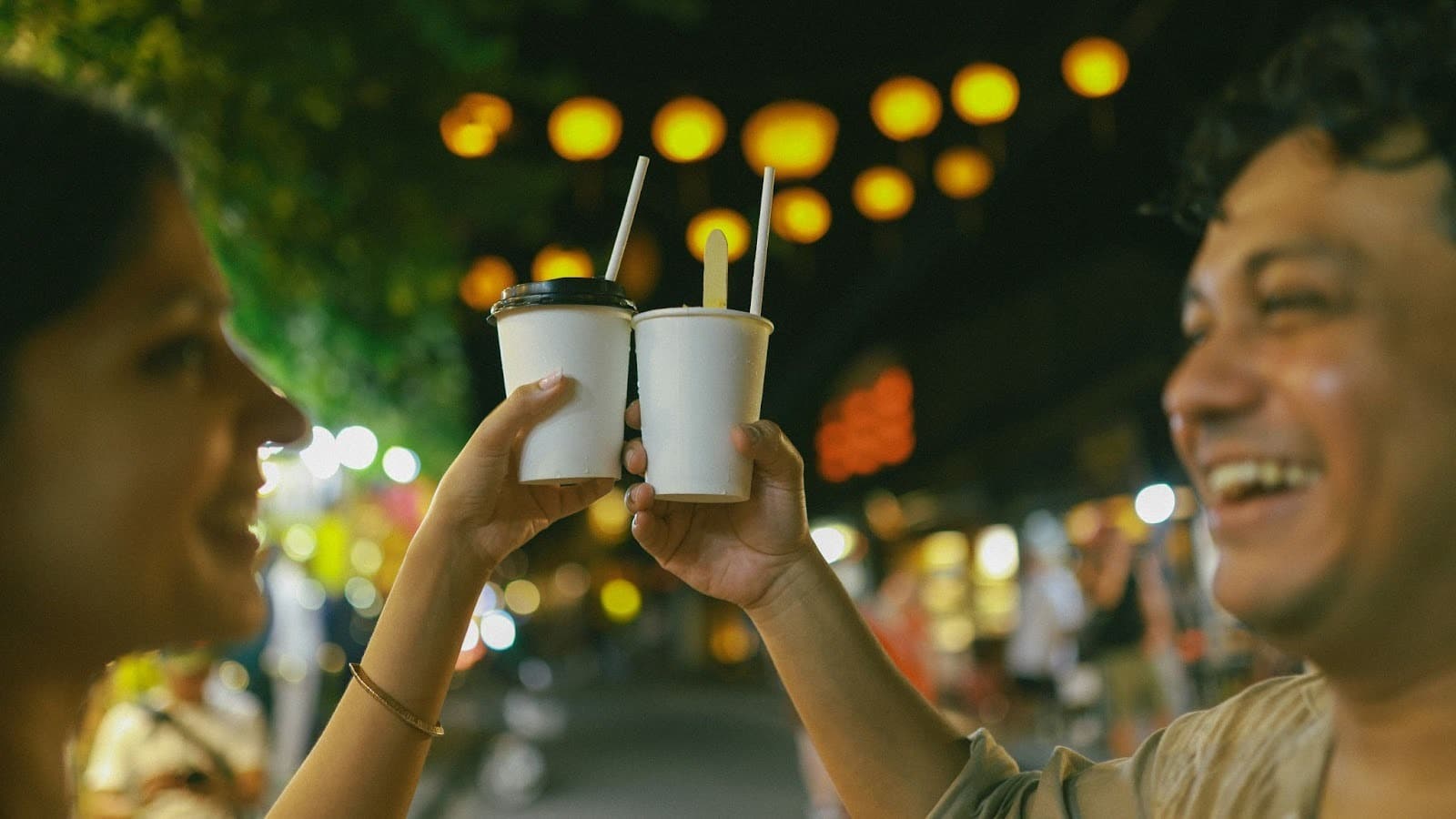 A man and woman outside during night