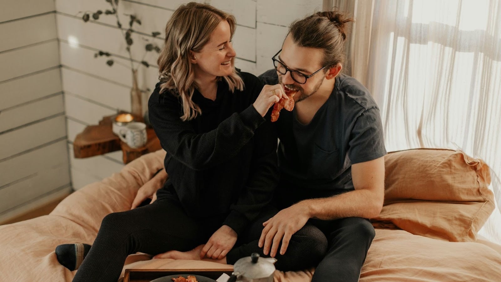 A man and woman doing taste test