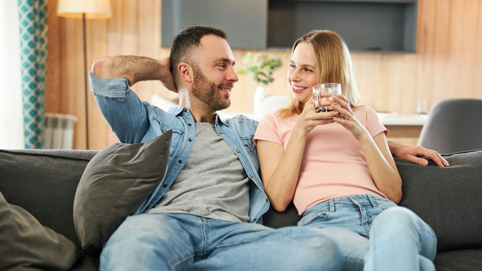 A man and woman at the sofa