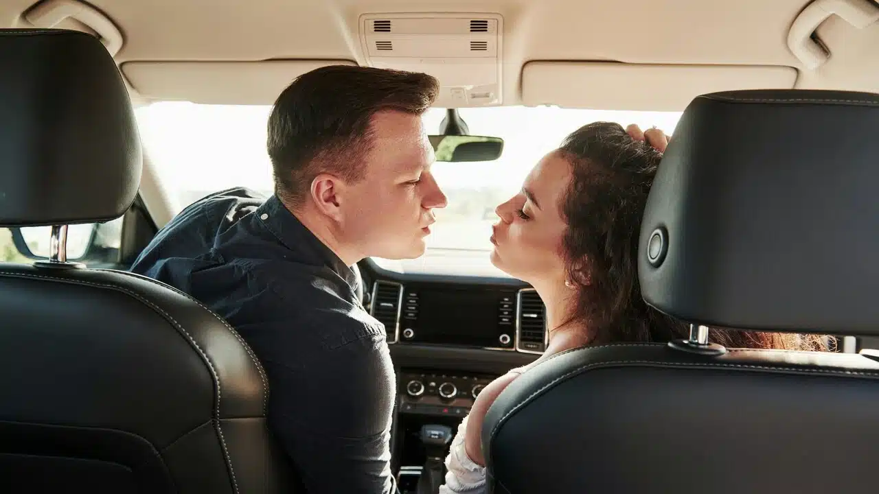 A man kissing his wife