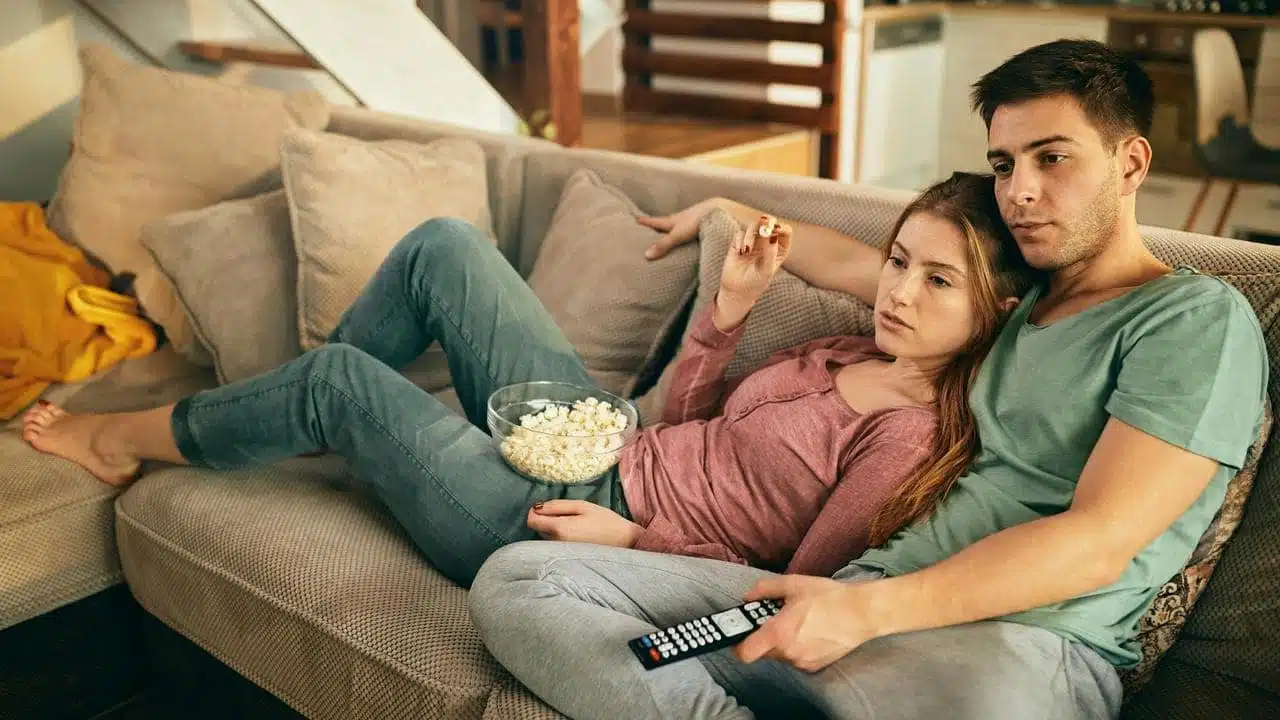 A couple relaxing on a couch