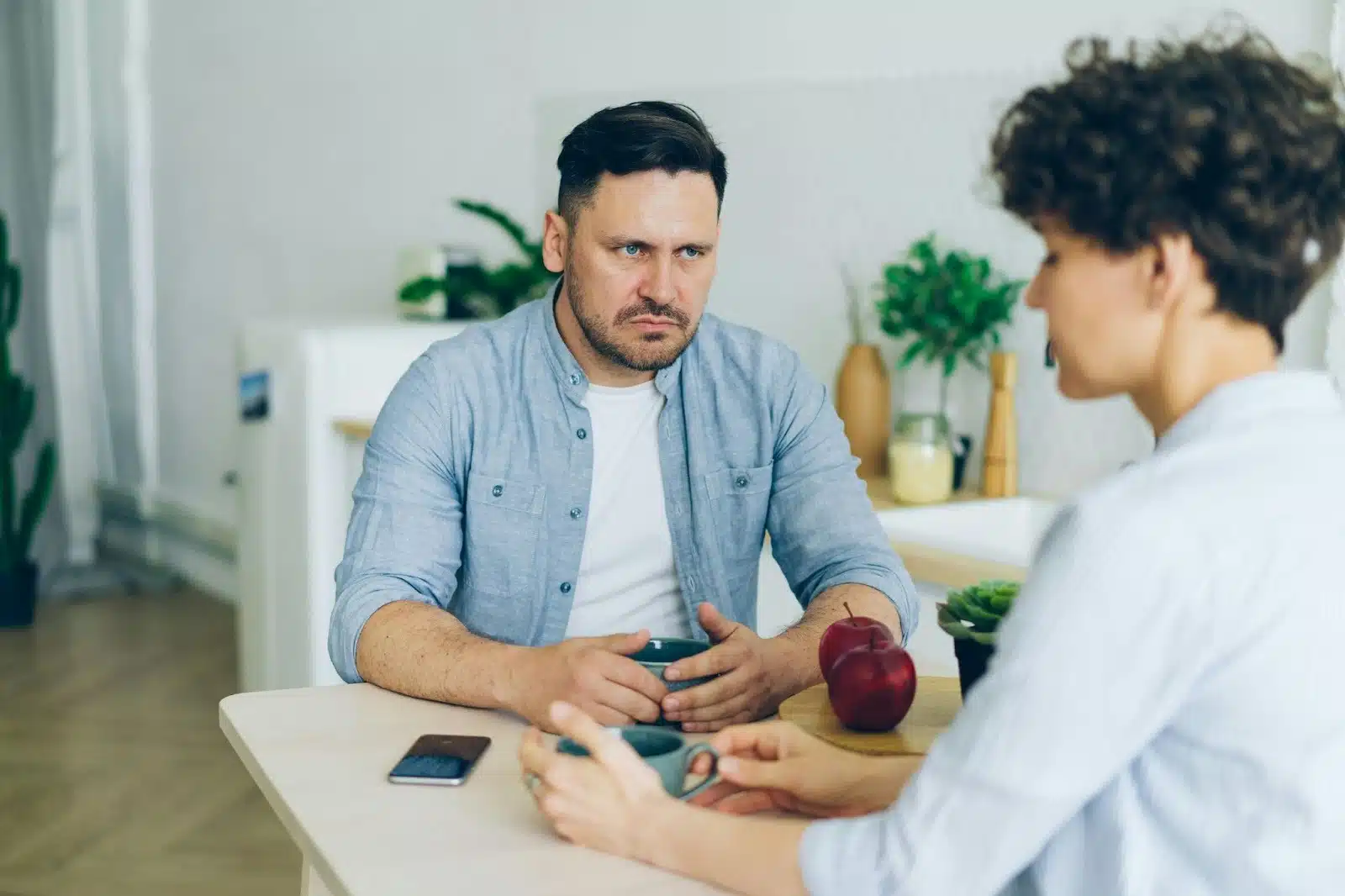 A man looking at the woman