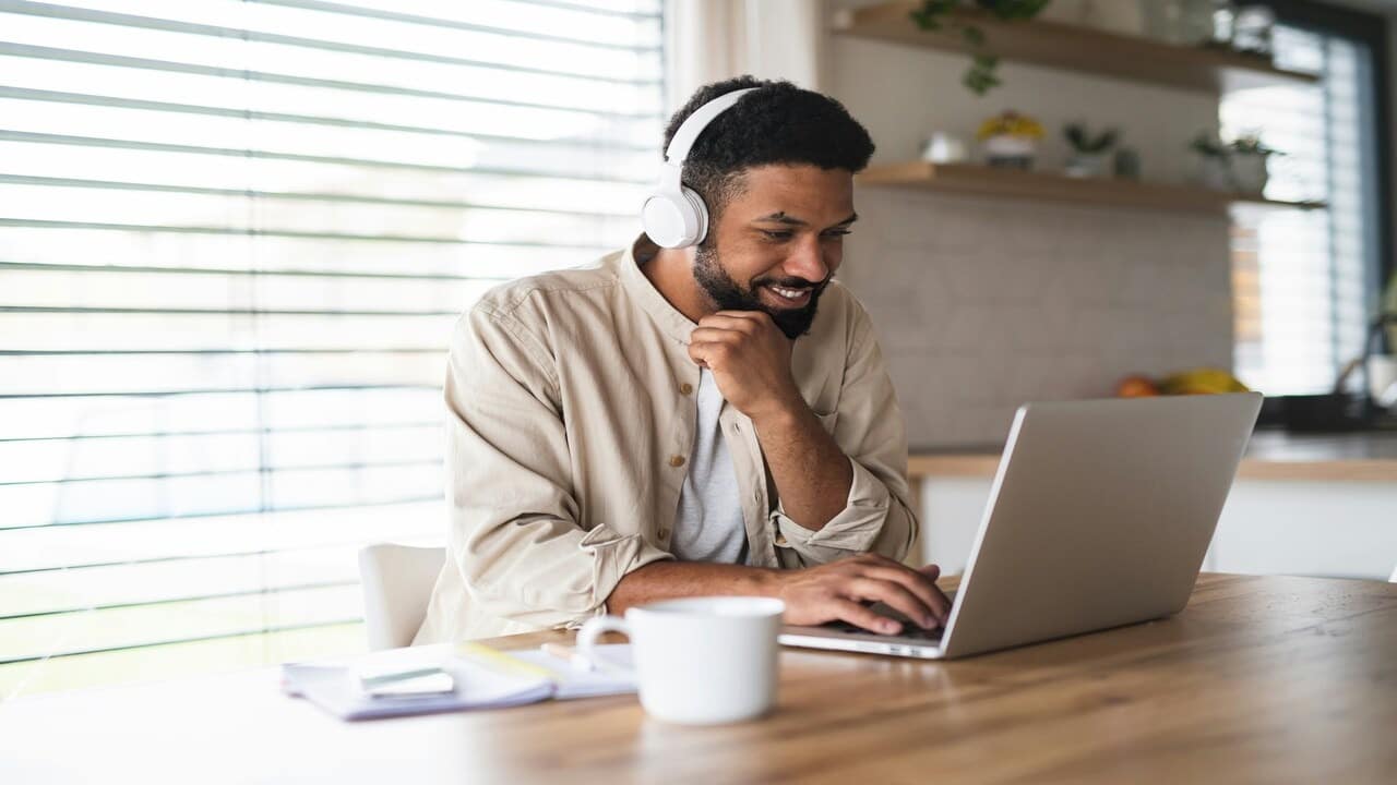 A man attending an online class