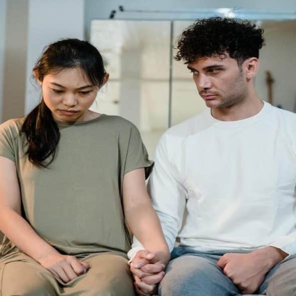 A couple looking upset while talking