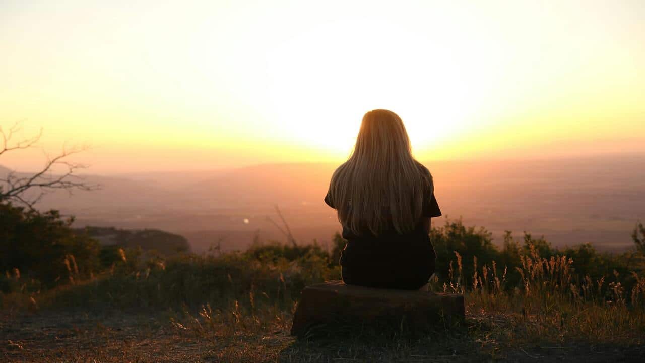 A woman watching the sunset