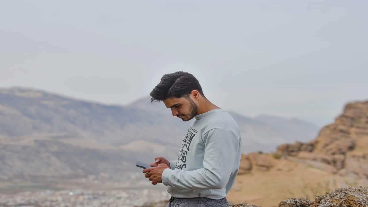 A man looking at his phone