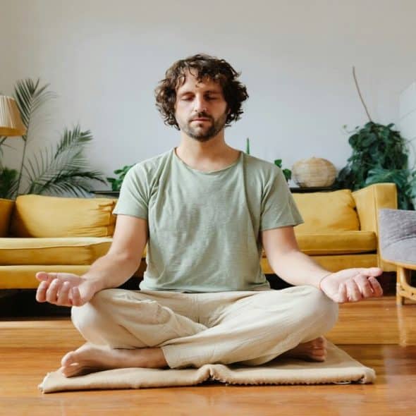 A man starting the day with yoga