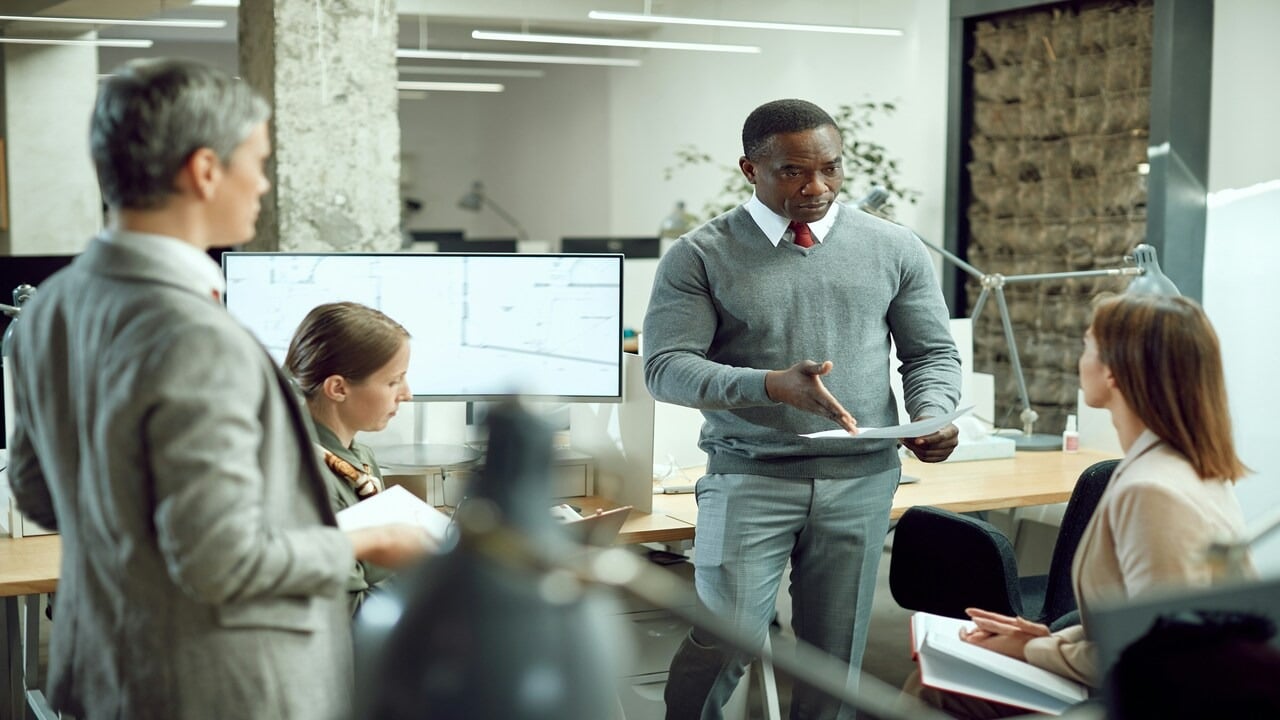 A man talking to his team