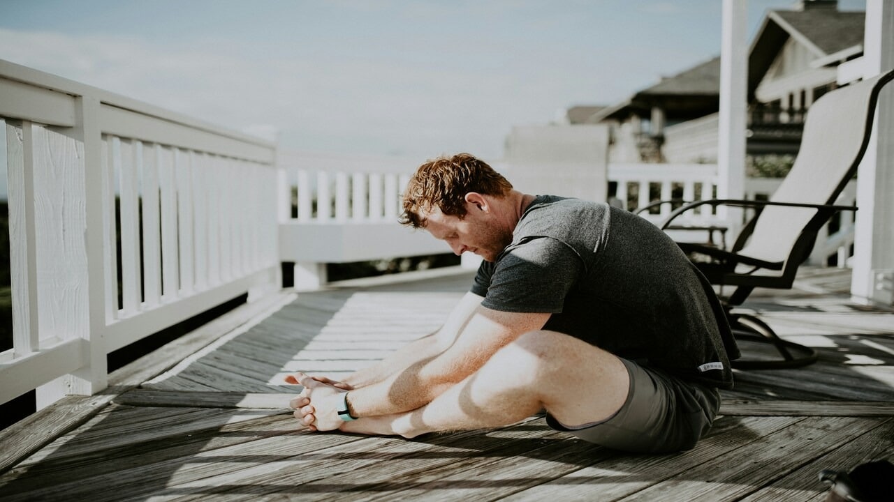 A man doing yoga by himself