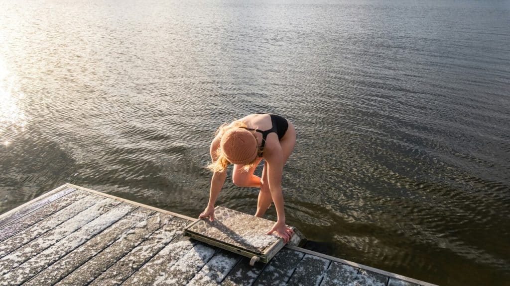 A woman about to swim in the morning