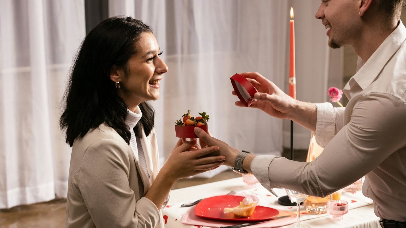 A man surprising a woman with a gift