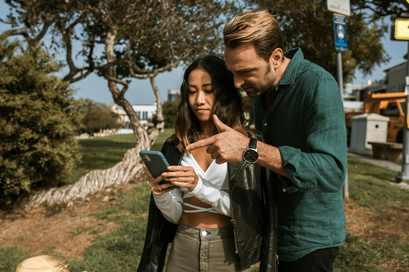 Two people looking at a phone