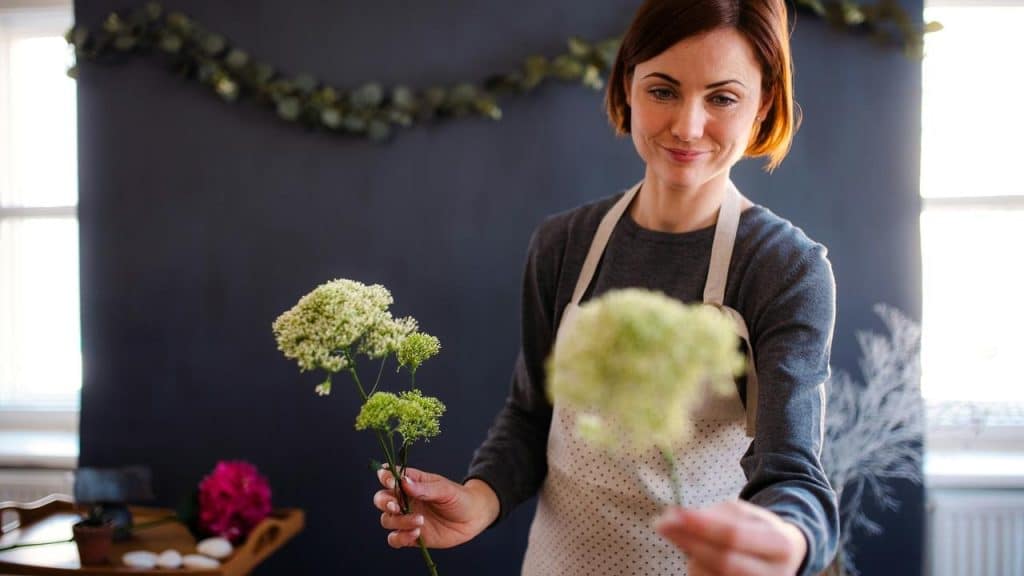 A woman arranging flowers