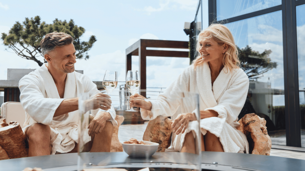 A beautiful mature couple toasting in their bathrobes