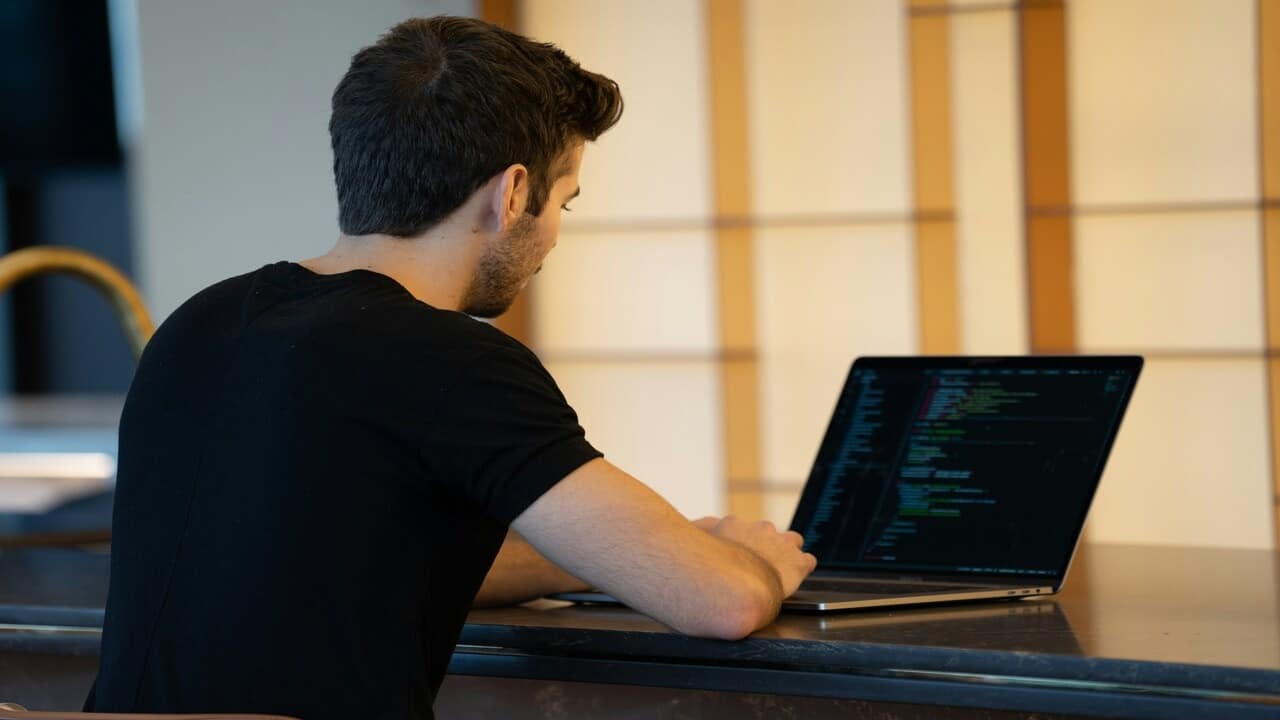 A man learning how to code