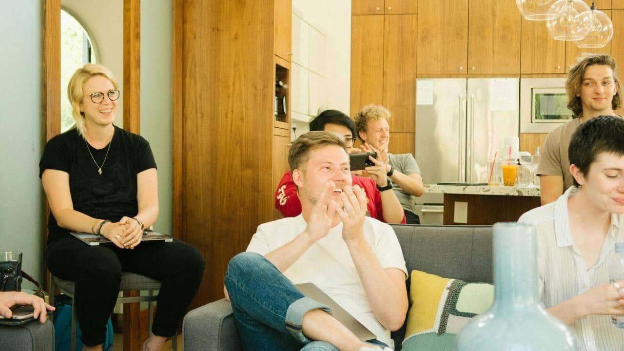 A man clapping at a gathering