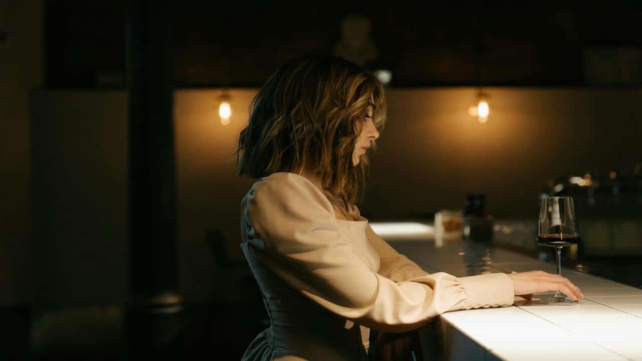 A woman alone at a bar
