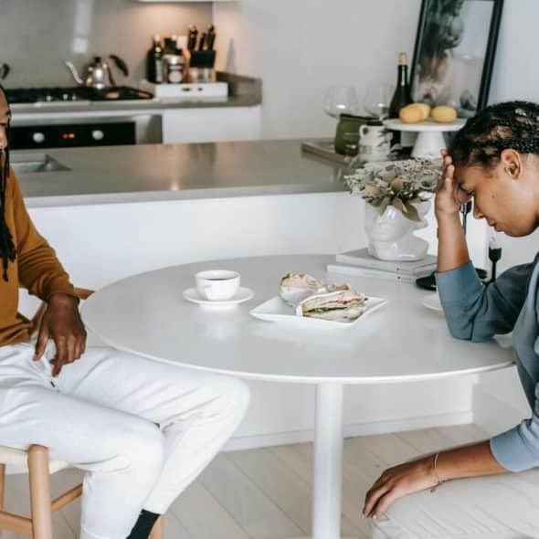 A sad couple in the kitchen