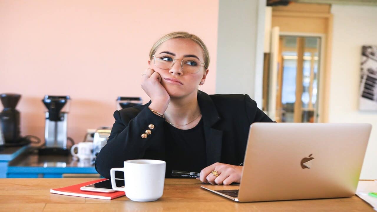A woman looking bored and checked out