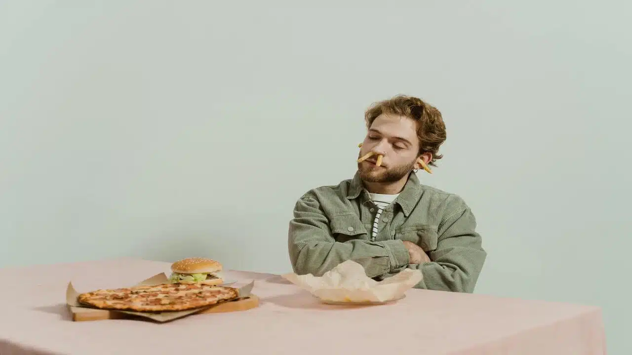 A man playing with his food